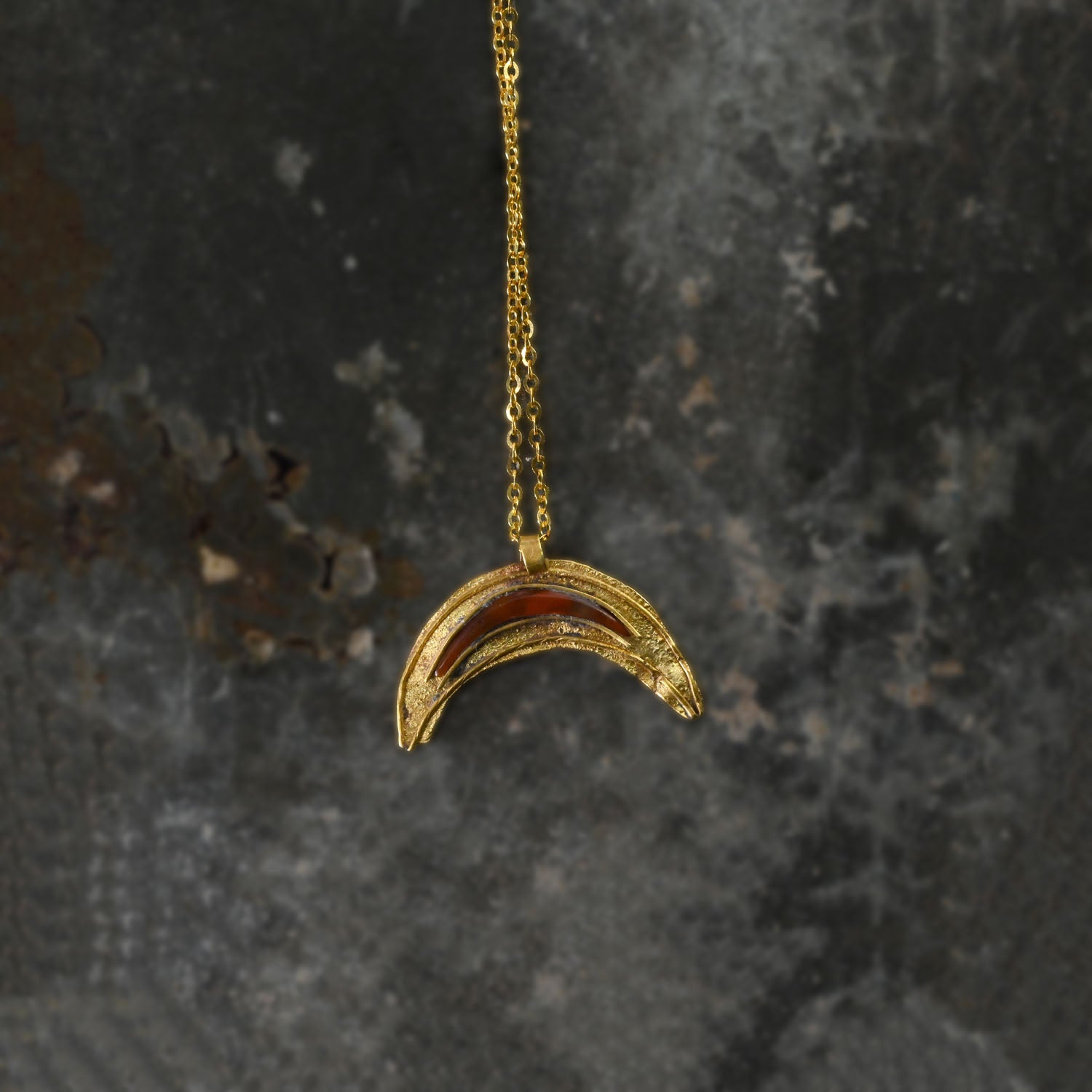 A Roman Gold and Red Jasper Luna Pendant, Roman Imperial Period, ca. 2nd- 3rd century CE