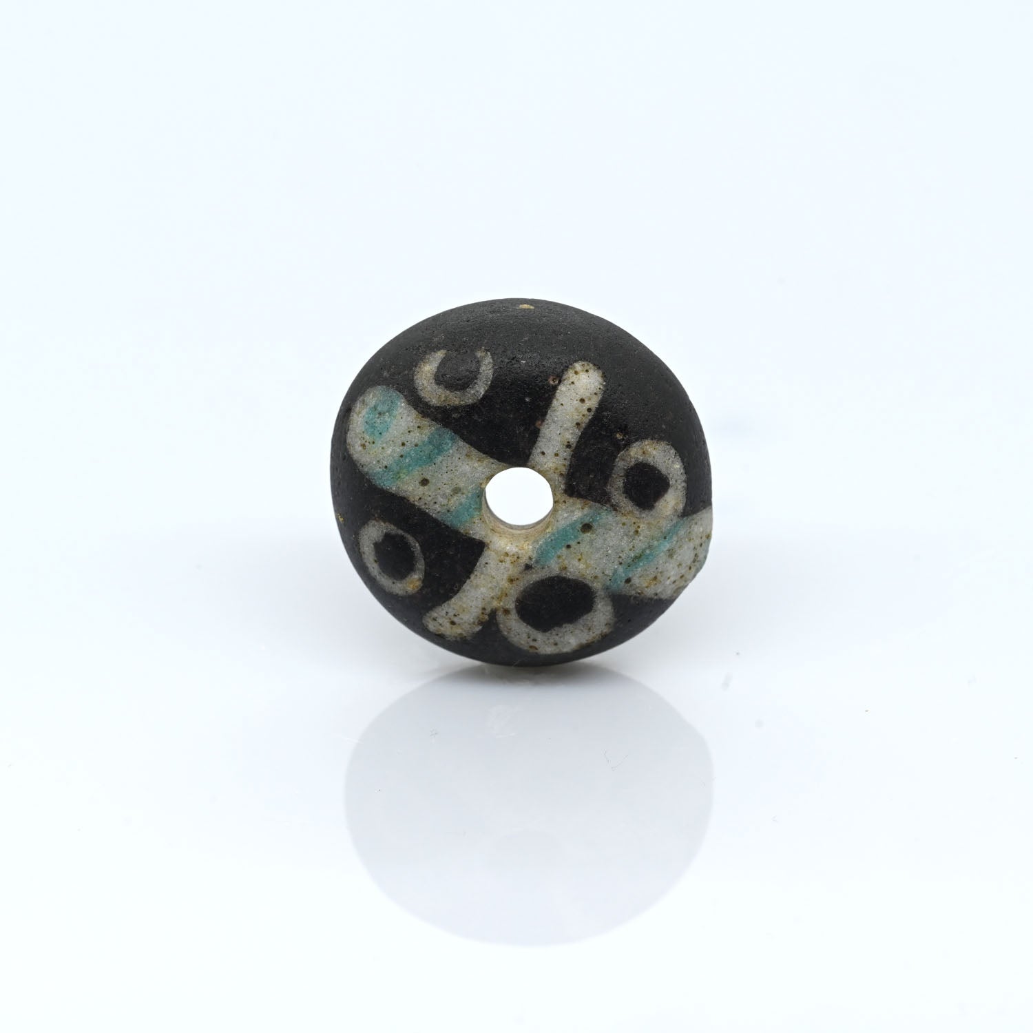 A Roman Decorated Glass Spindle Whorl, Roman Imperial Period, ca. 2nd - 3rd century CE