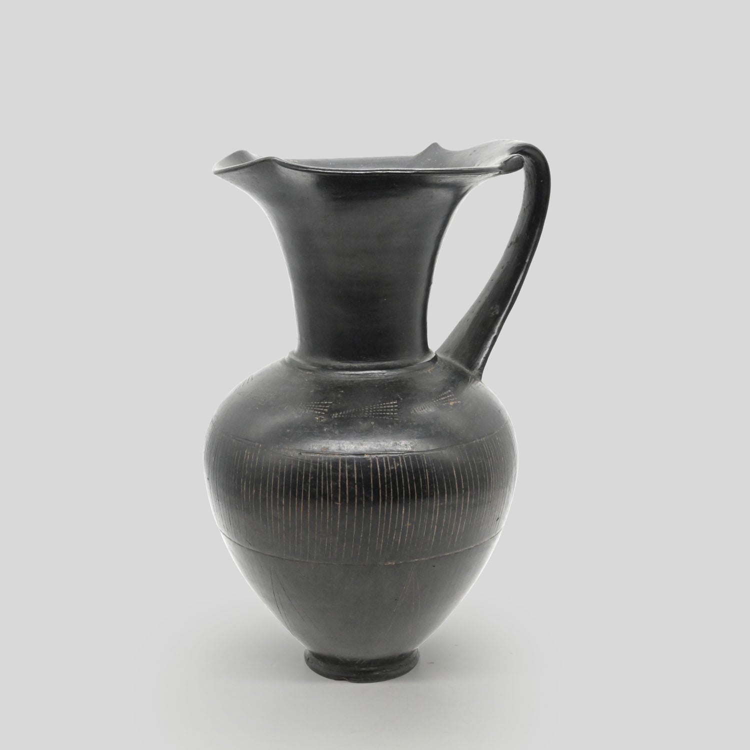 A published Etruscan Bucchero Pitcher, ca. 6th century BCE