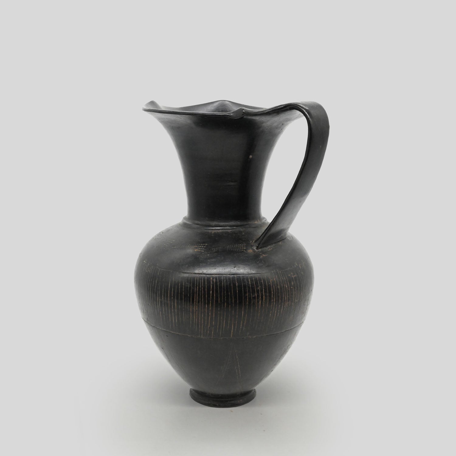 A published Etruscan Bucchero Pitcher, ca. 6th century BCE