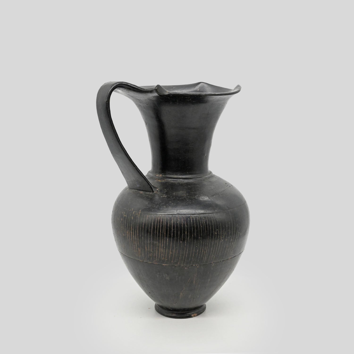 A published Etruscan Bucchero Pitcher, ca. 6th century BCE