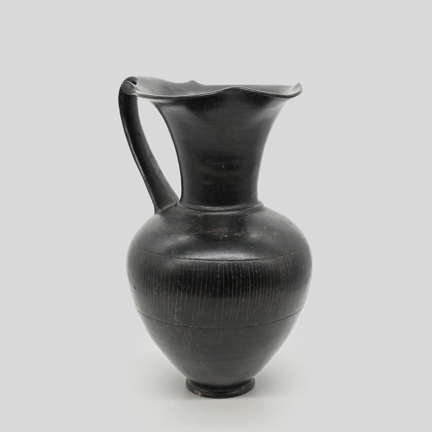 A published Etruscan Bucchero Pitcher, ca. 6th century BCE