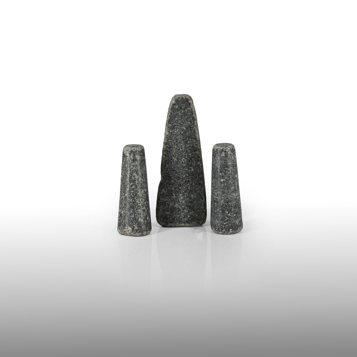 A set of three rare Sumerian Granite Gaming Pieces, Early Bronze Age, ca. 3100 - 2200 BCE