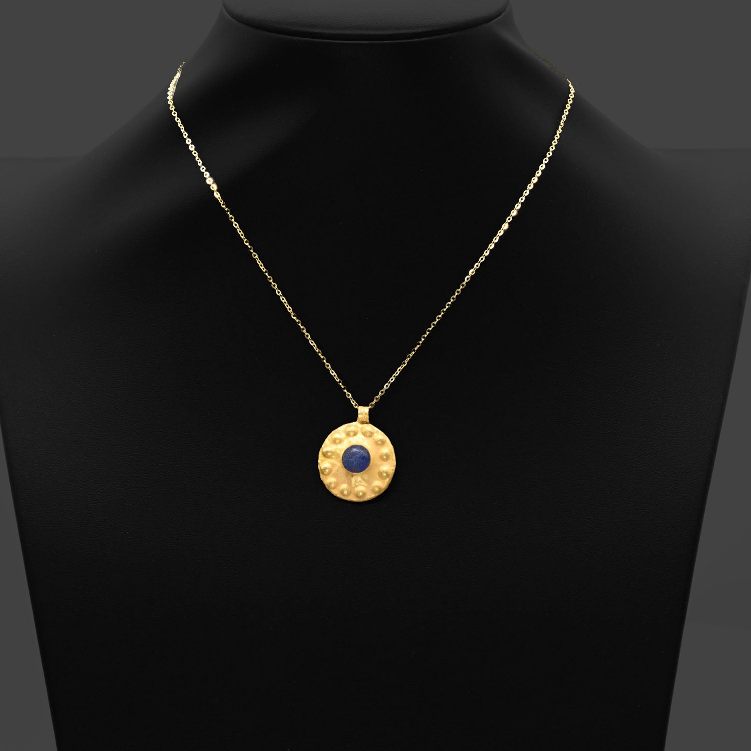 A Neo-Assyrian Gold and Glass pendant, circa 9th to 7th century BCE