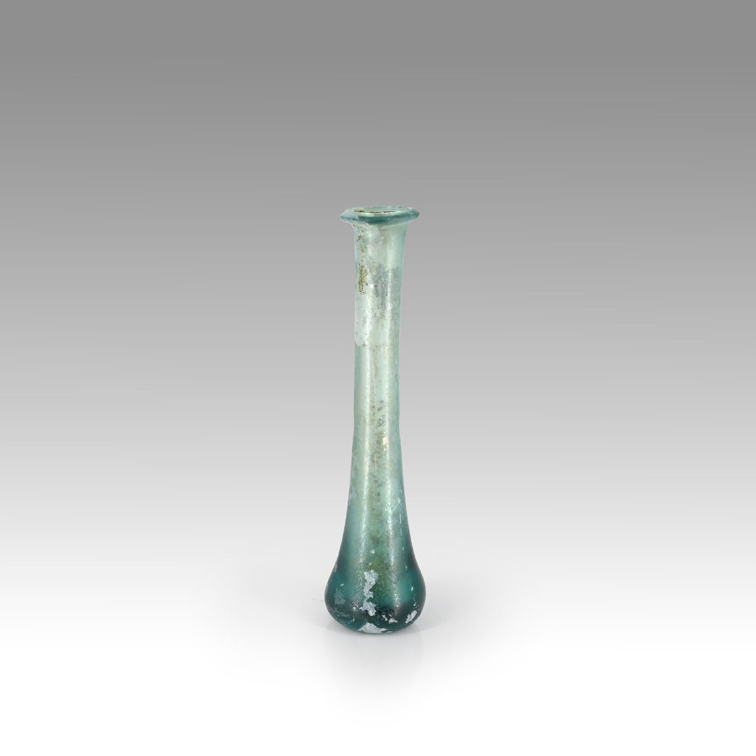 A Roman Aqua Blue Glass Tear Bottle, Roman Imperial Period, ca. 1st - 2nd century CE