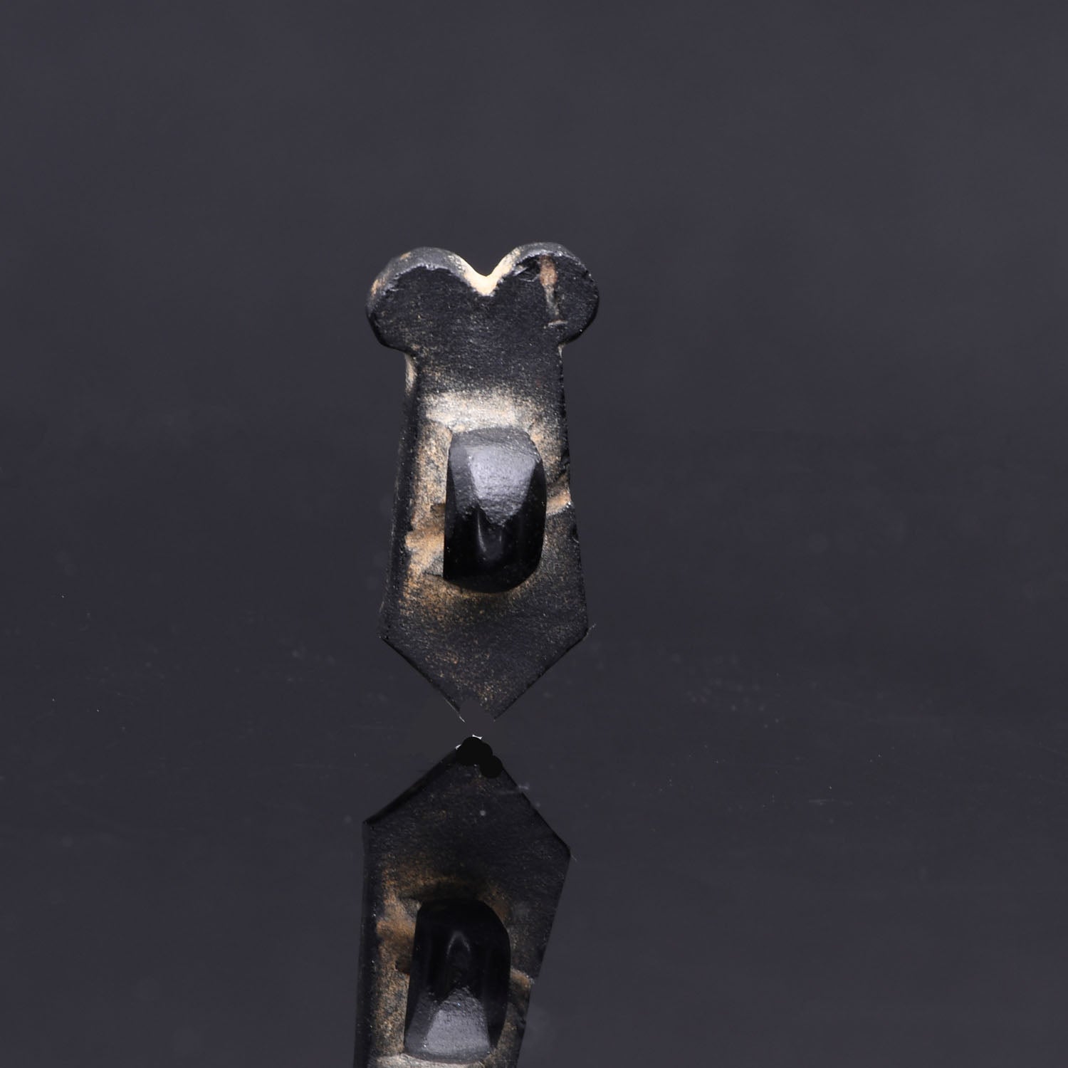 An Egyptian Obsidian Double Maat Feather Amulet, Late Period, 26th Dynasty, ca. 664 - 525 BCE