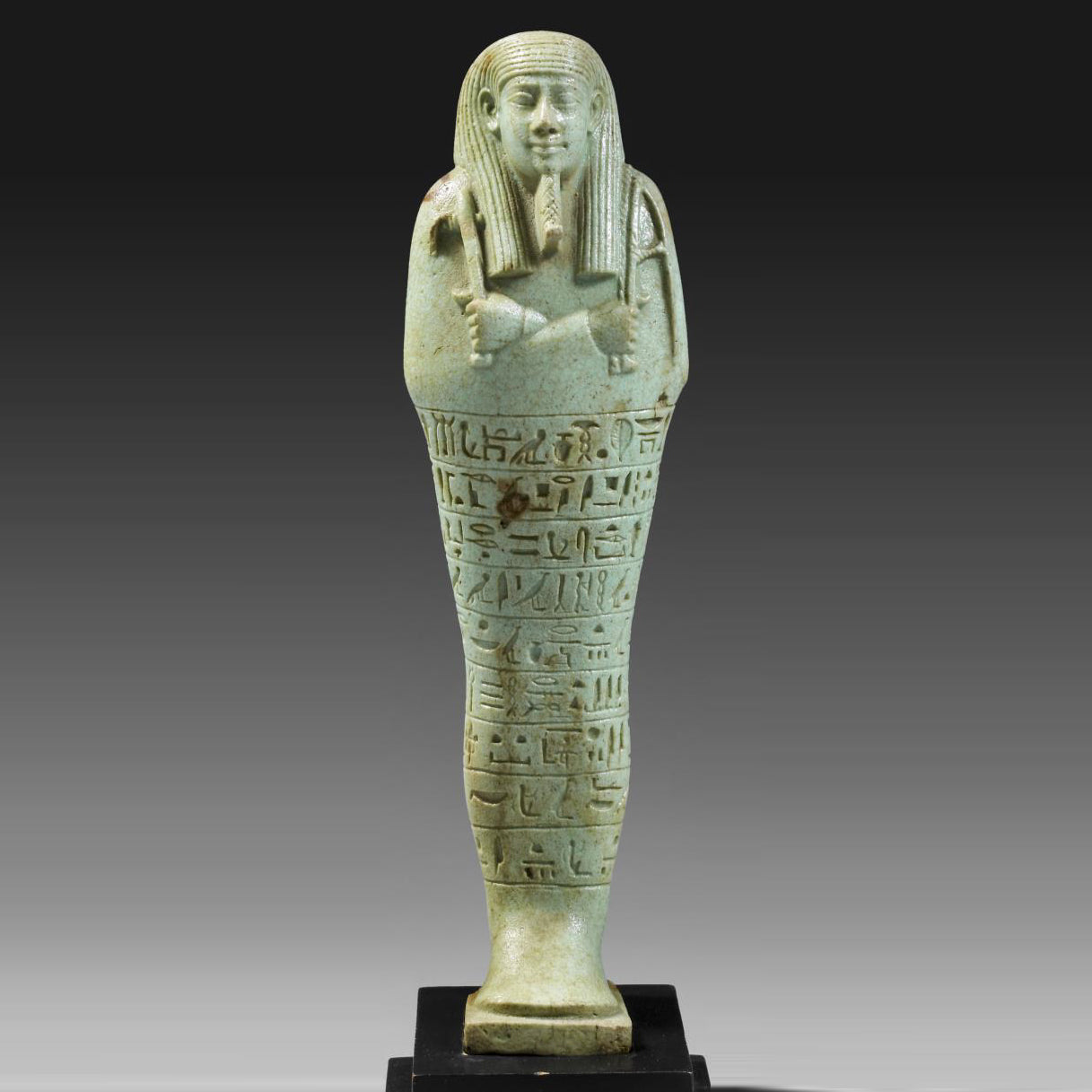 An exceptional Egyptian Faience Ushabti for Wah-ib-re-em-akhet, 26th Dynasty, 664 - 525 BC