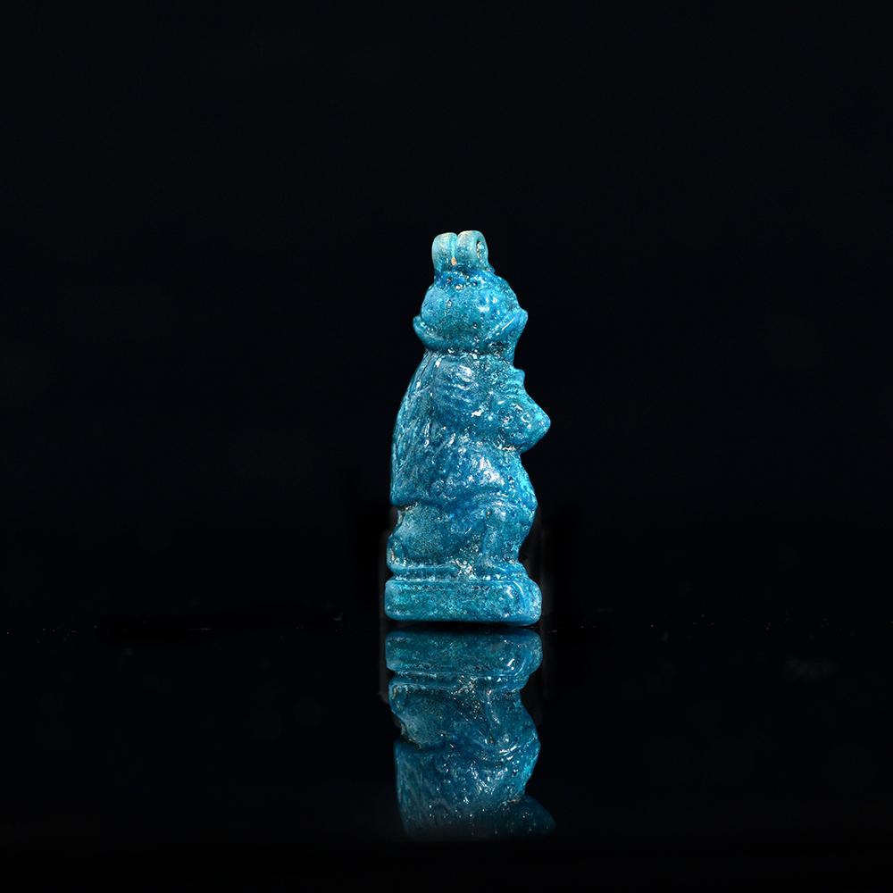 An Egyptian Faience Baboon Amulet, Third Intermediate Period, 21st Dynasty, ca. 900 - 700 BCE