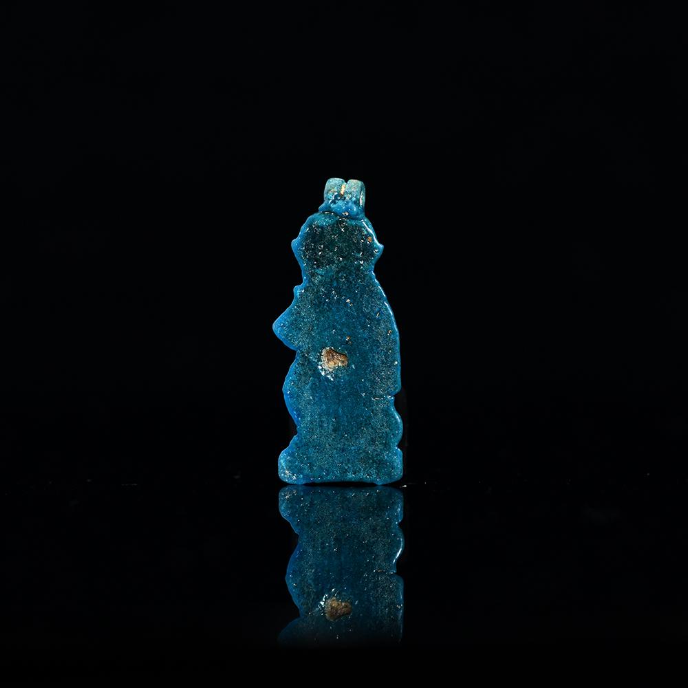 An Egyptian Faience Baboon Amulet, Third Intermediate Period, 21st Dynasty, ca. 900 - 700 BCE