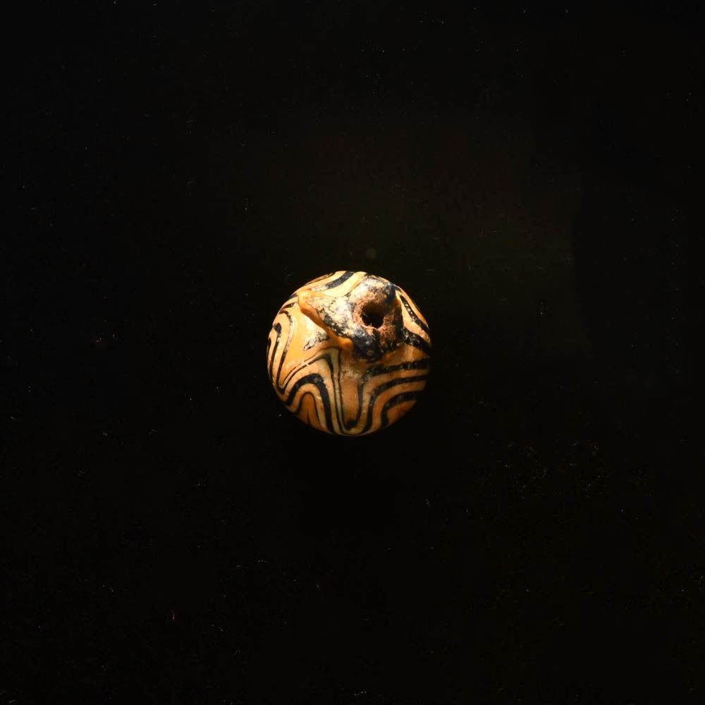 An Egyptian Glass Pomegranate Amulet, New Kingdom, 18th - 19th Dynasty, ca. 1350 - 1250 BCE