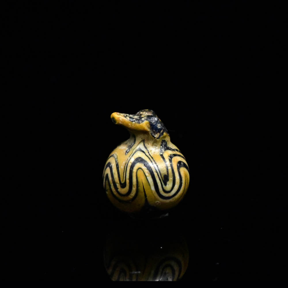 An Egyptian Glass Pomegranate Amulet, New Kingdom, 18th - 19th Dynasty, ca. 1350 - 1250 BCE