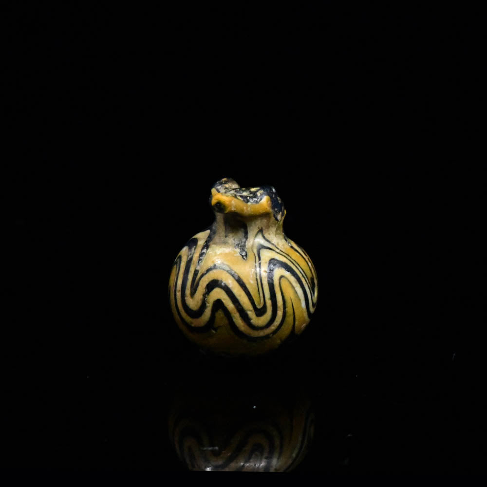 An Egyptian Glass Pomegranate Amulet, New Kingdom, 18th - 19th Dynasty, ca. 1350 - 1250 BCE