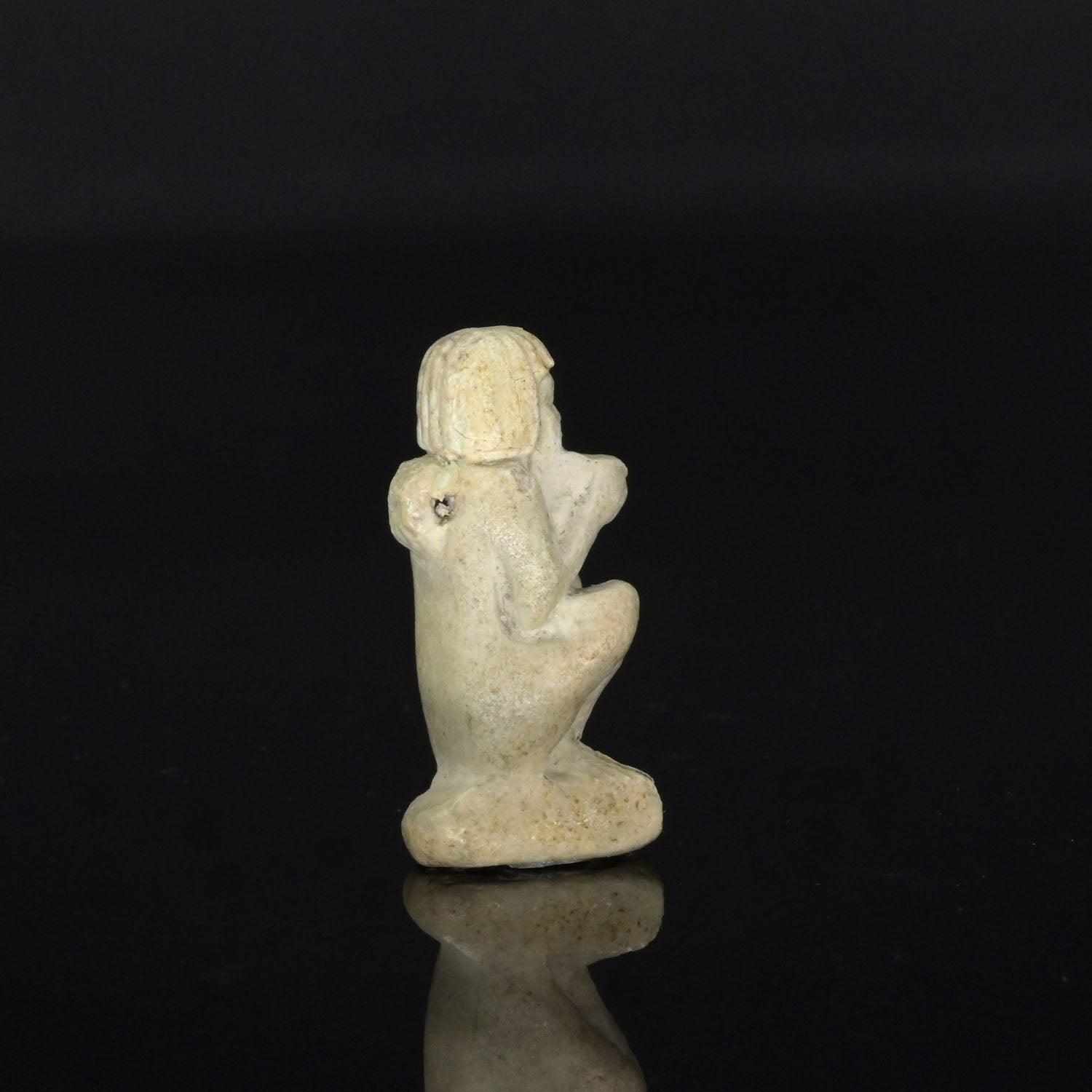 An Egyptian Faience Amulet of a Supplicant, Late Period, ca. 664 - 332 BCE