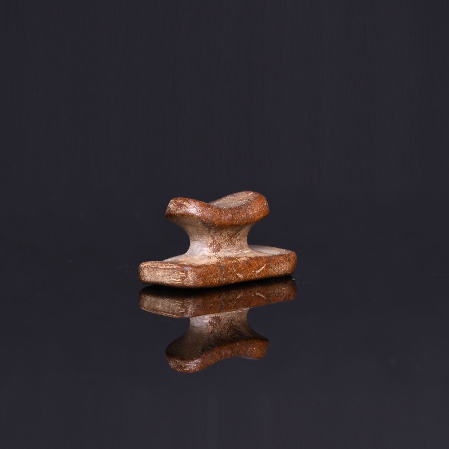 An Egyptian Stone Headrest Amulet, Third Intermediate Period, ca. 1069 - 664 BCE