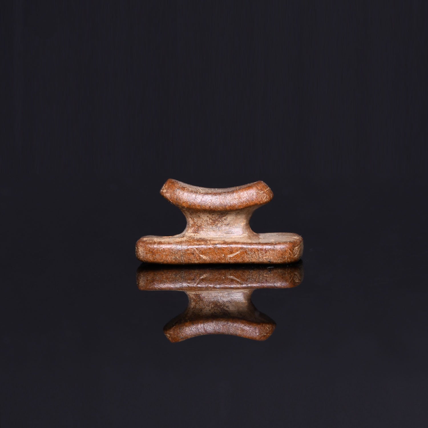 An Egyptian Stone Headrest Amulet, Third Intermediate Period, ca. 1069 - 664 BCE