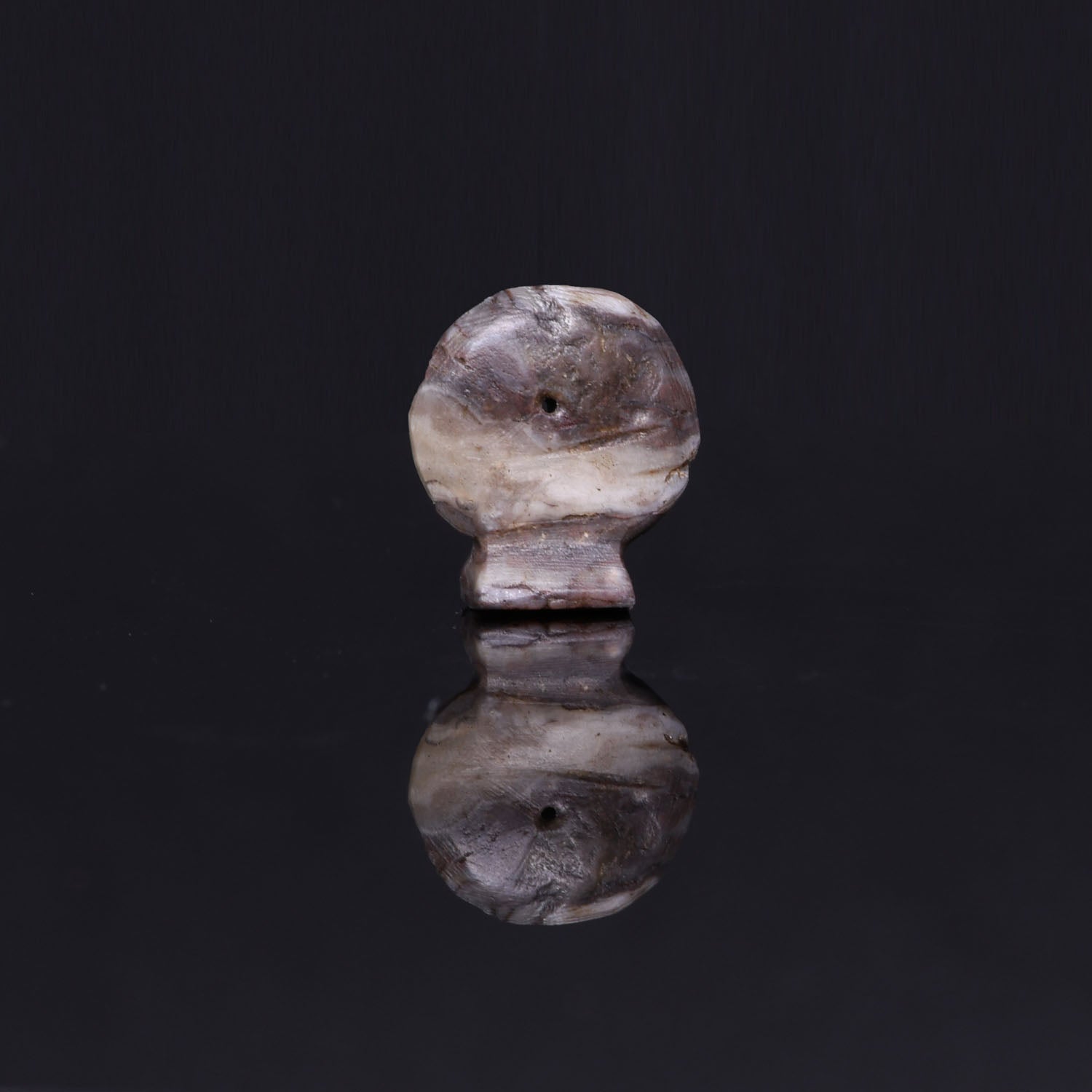 An Egyptian Diorite Sun Disc Amulet, Late Period, ca. 664 - 332 BCE