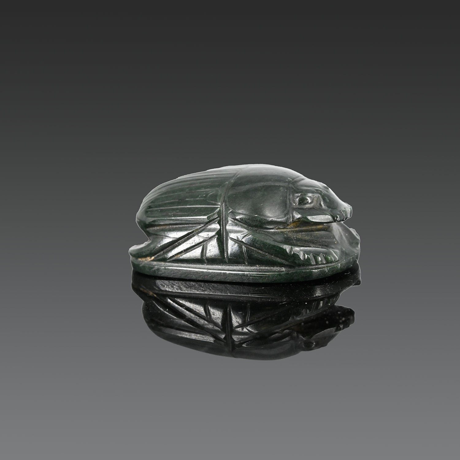 An Exhibited Egyptian Green Serpentine Heart Scarab, 26th Dynasty, ca. 664 - 525 BCE