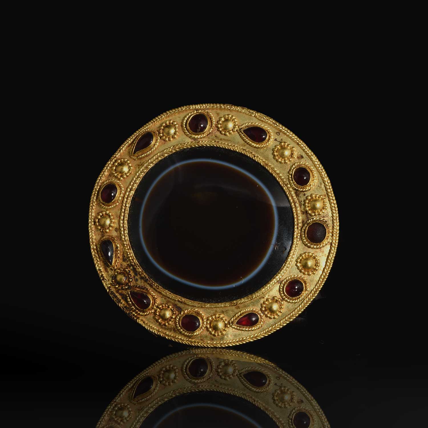 An Important Persian Eye Agate Pectoral, Parthian Period, ca. 1st century BCE - 1st century CE
