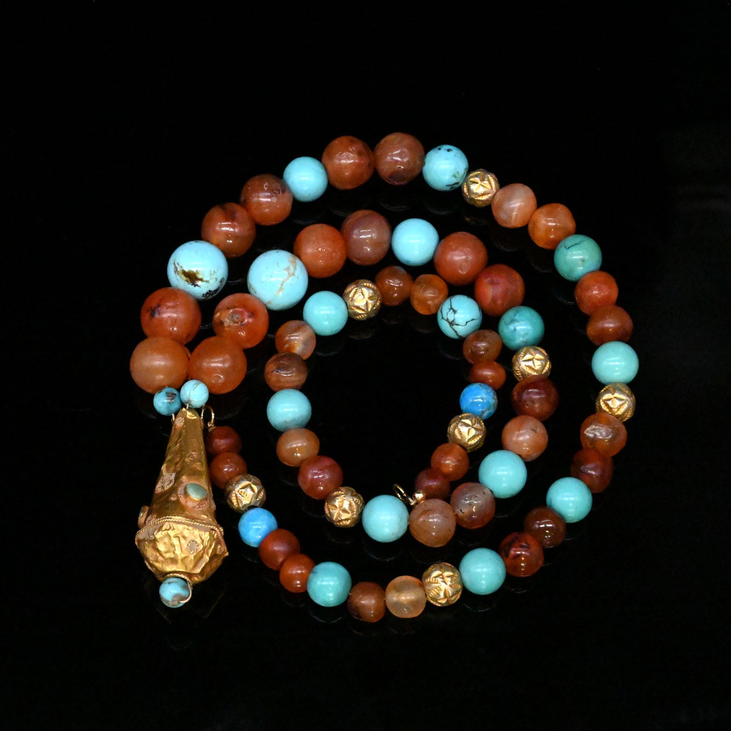 An Islamic Gold, Carnelian and Turquoise Pendant, Seljuk Period, ca. 1200 CE