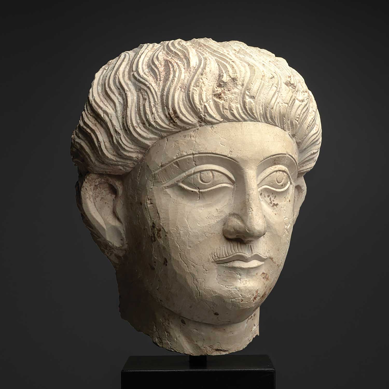 A good Palmyrene Limestone Portrait Head of a Youth ca. 2nd - 3rd century CE