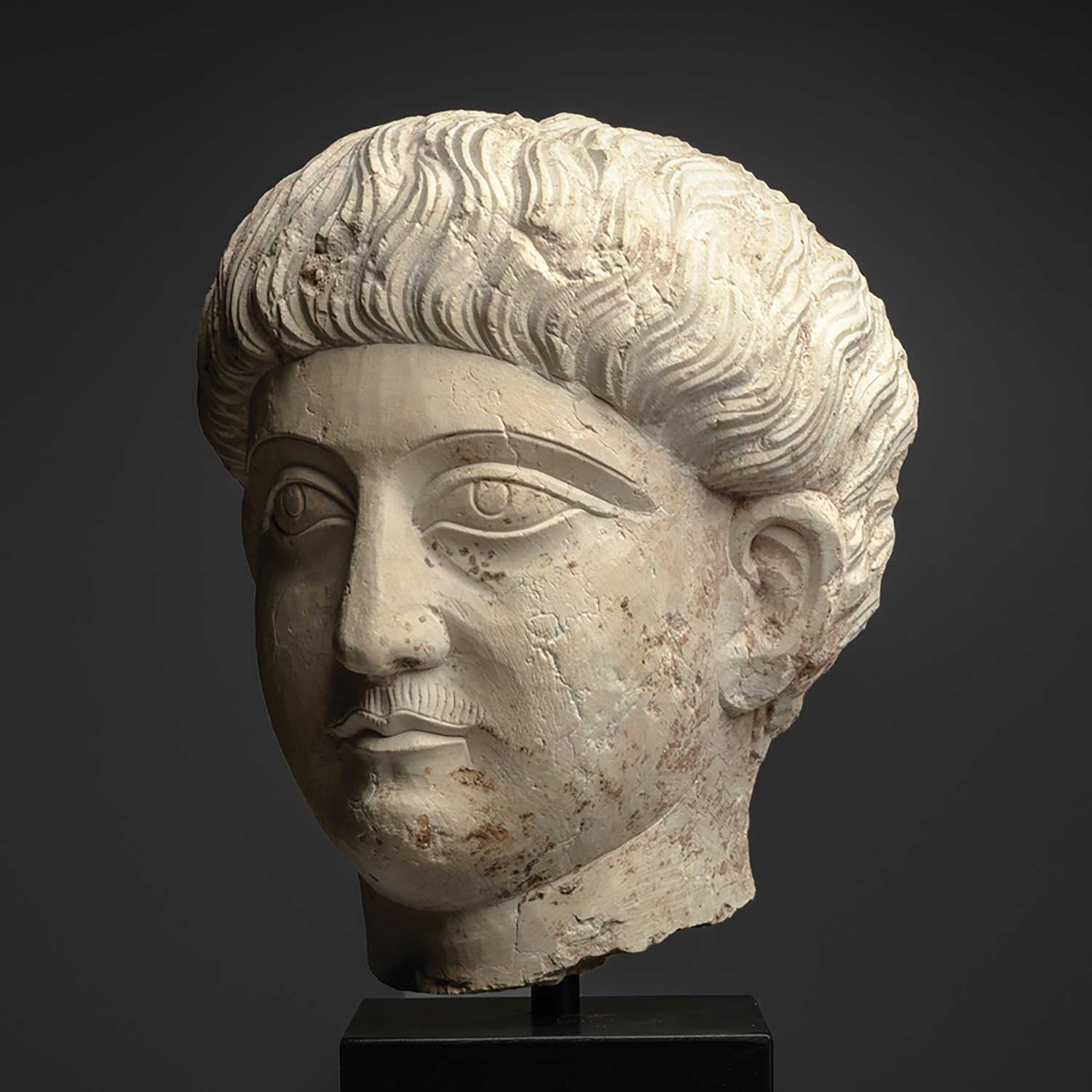 A good Palmyrene Limestone Portrait Head of a Youth ca. 2nd - 3rd century CE
