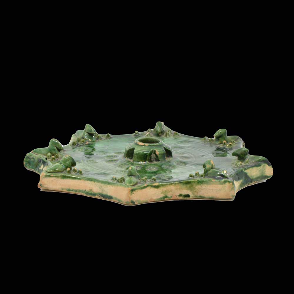 An Islamic Green Glazed Star Tile, ca. 15th - 16th century