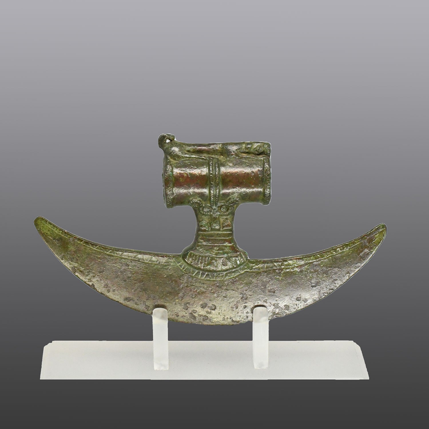 A rare Near Eastern Bronze Crescent Axehead, ca. 1100 - 900 BCE