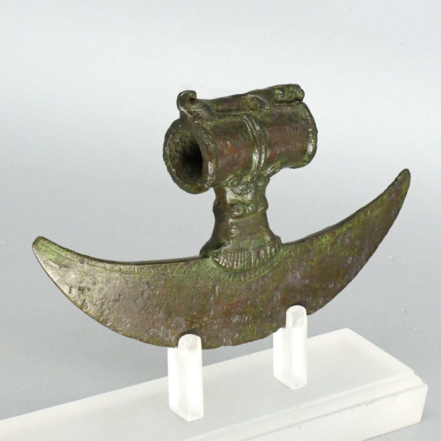 A rare Near Eastern Bronze Crescent Axehead, ca. 1100 - 900 BCE