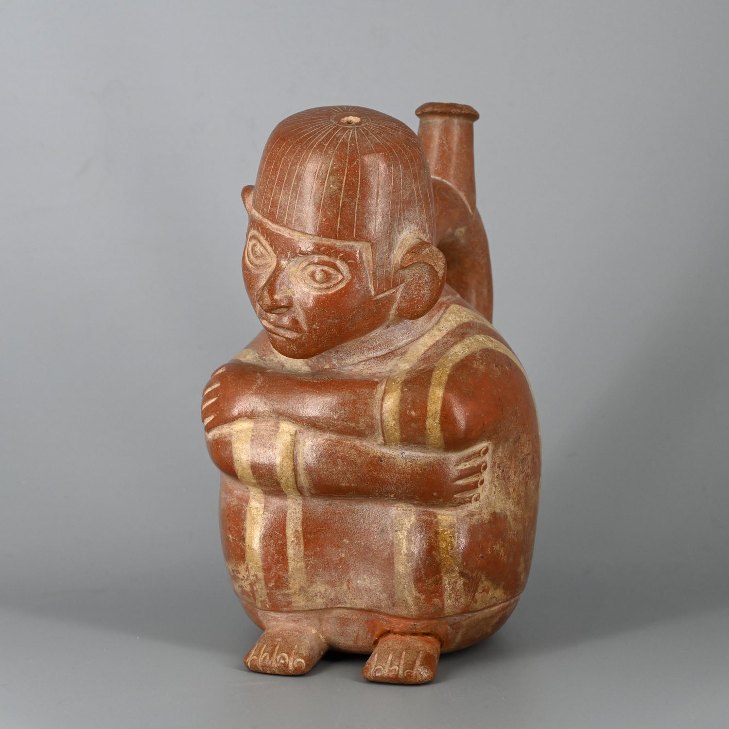 A Moche Stirrup Bottle with a Seated Man, ca. 200 - 400 CE