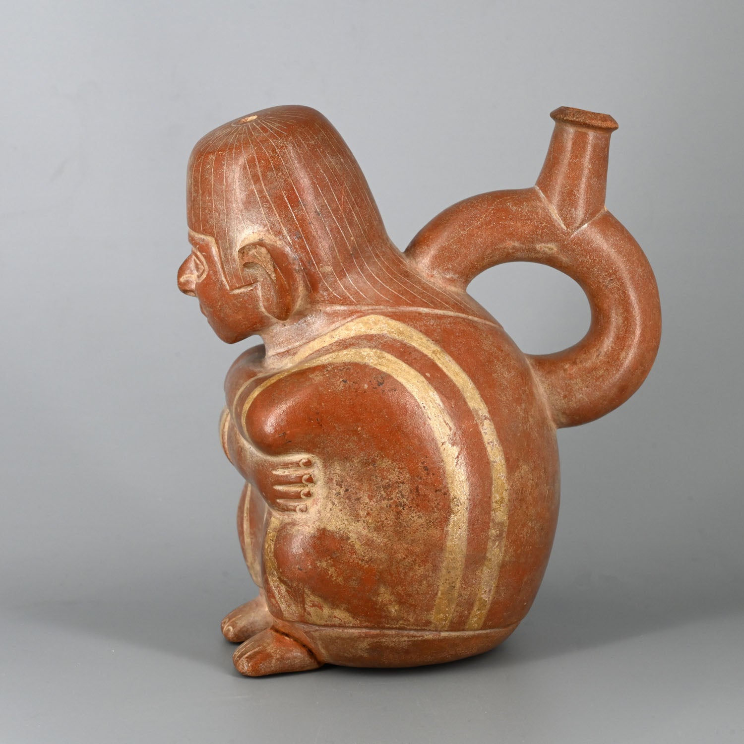 A Moche Stirrup Bottle with a Seated Man, ca. 200 - 400 CE
