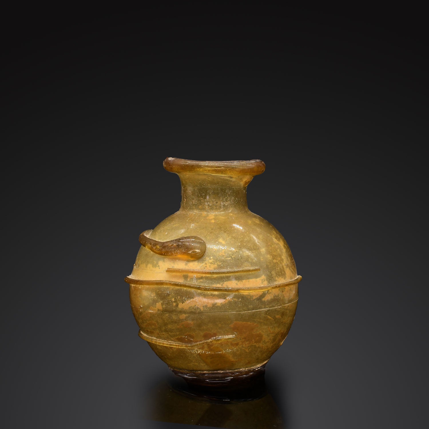 A Roman Amber Glass Bottle, ca. 2nd - 3rd century CE