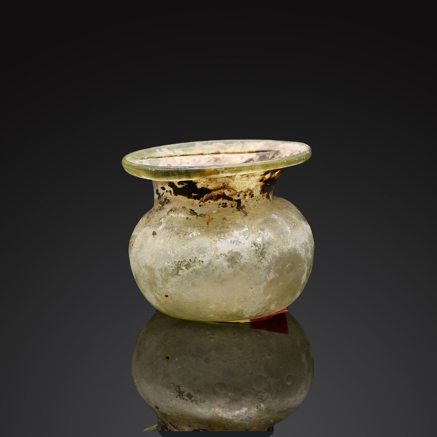 A Roman Green Glass Vessel, Roman Imperial Period, ca. 1st - 2nd century CE