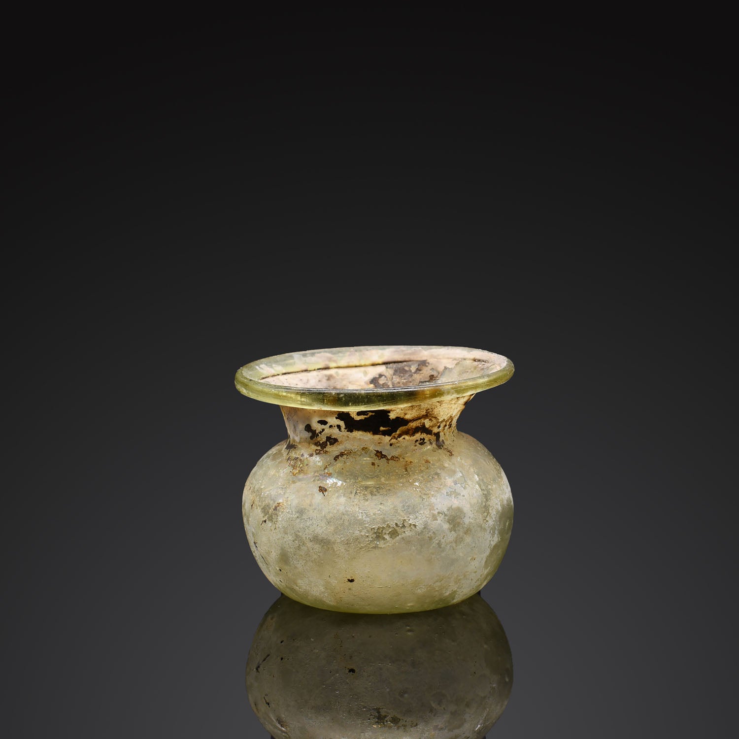 A Roman Green Glass Vessel, Roman Imperial Period, ca. 1st - 2nd century CE