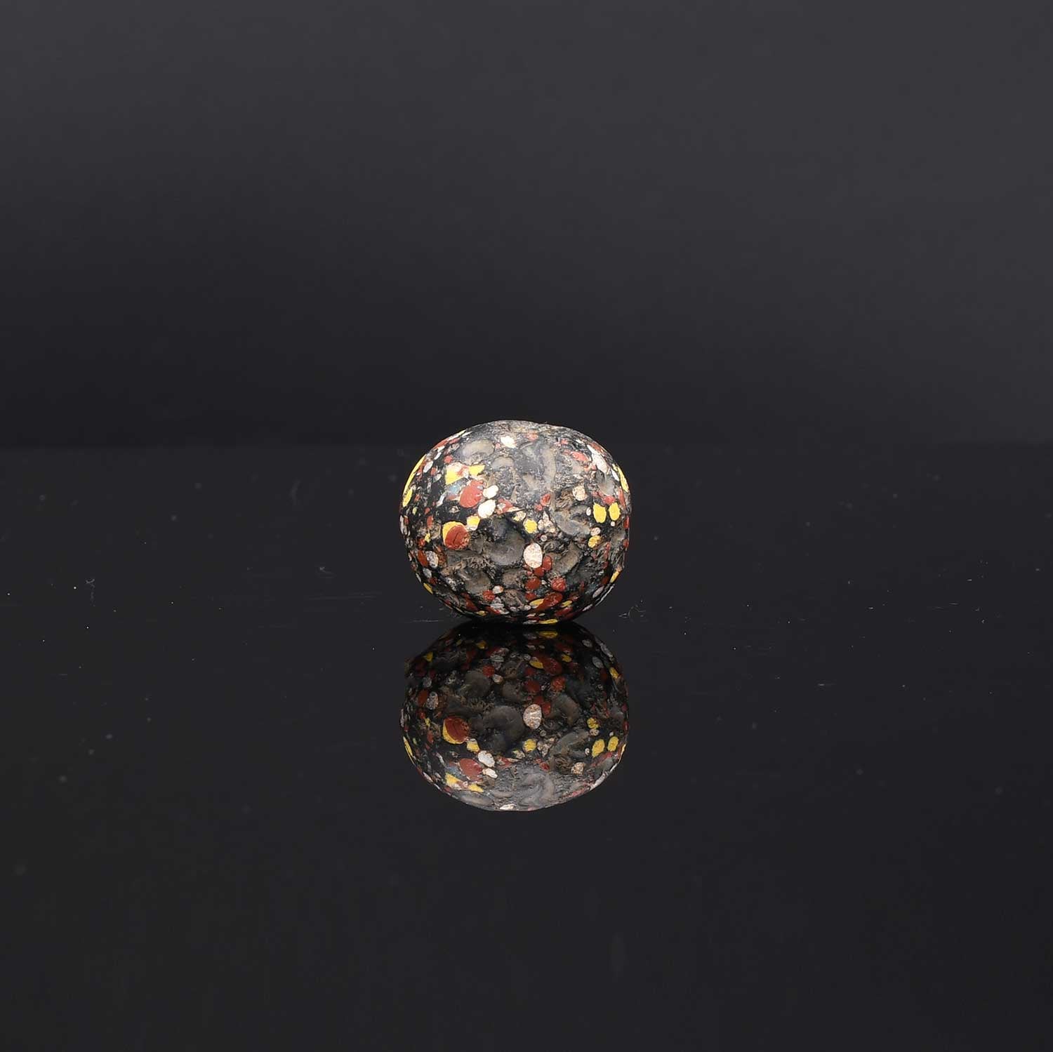 A Large Roman Glass Crumb Bead, Late Roman Imperial Period, ca. 3rd - 5th century CE