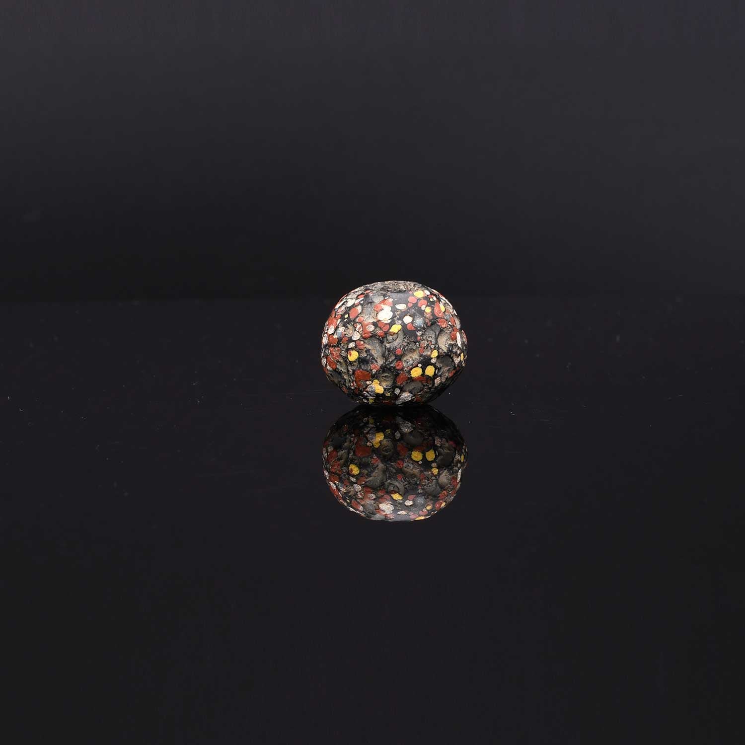 A Large Roman Glass Crumb Bead, Late Roman Imperial Period, ca. 3rd - 5th century CE