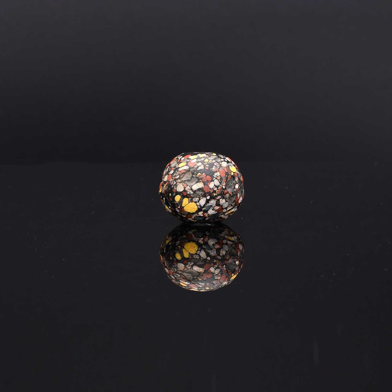 A Large Roman Glass Crumb Bead, Late Roman Imperial Period, ca. 3rd - 5th century CE