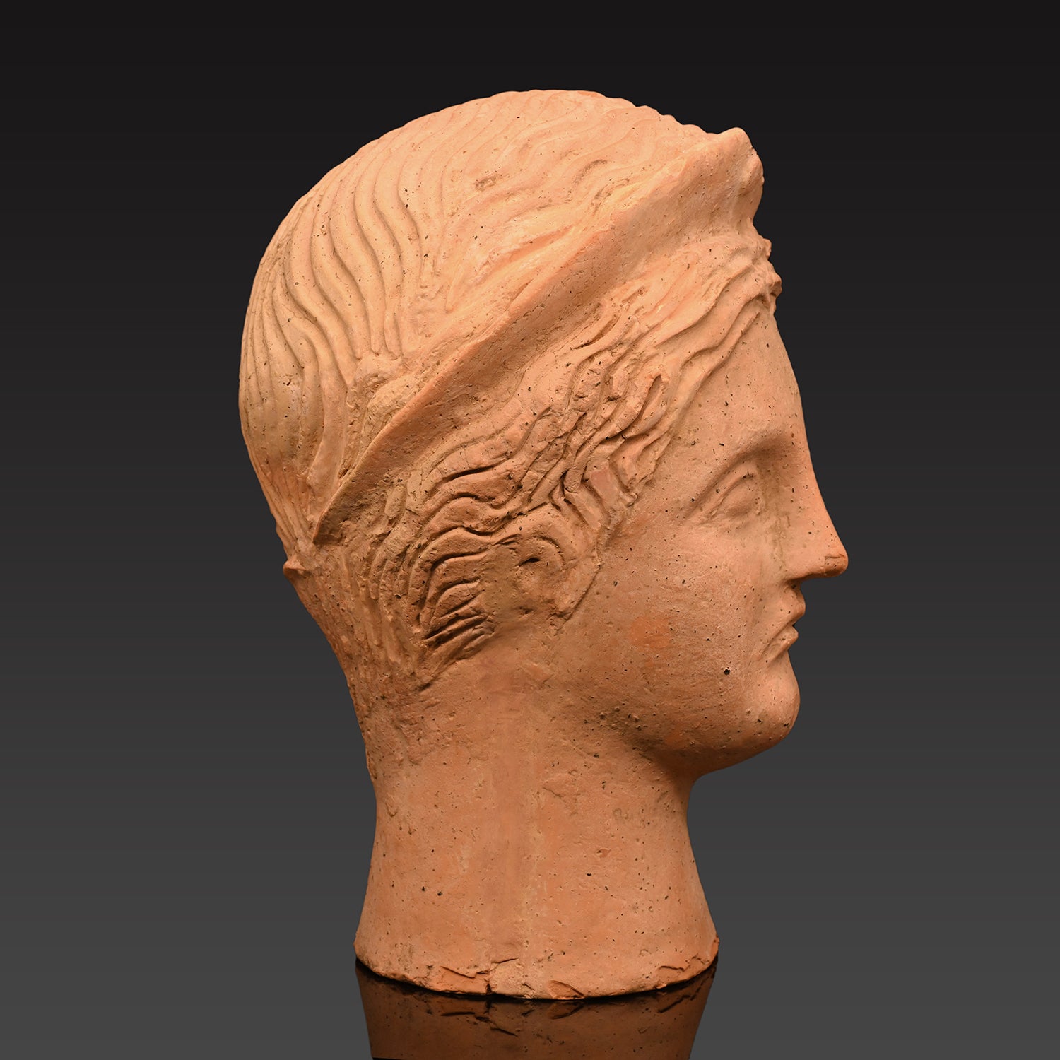 An Etruscan Terracotta Votive Head of A Goddess, ca. 4th - 3rd century BCE