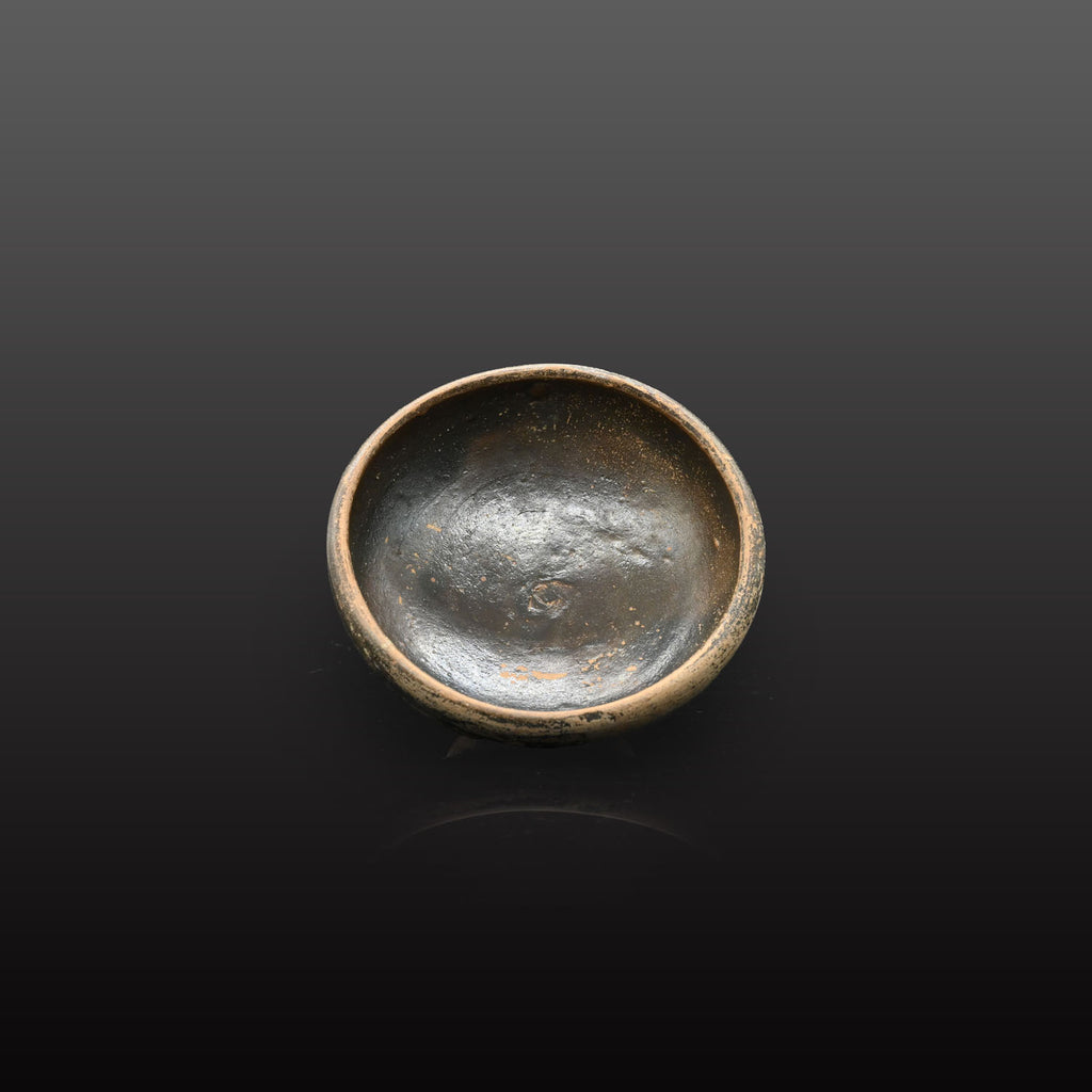 A small Greek Blackware Salt Dish, , ca. 4th century BCE