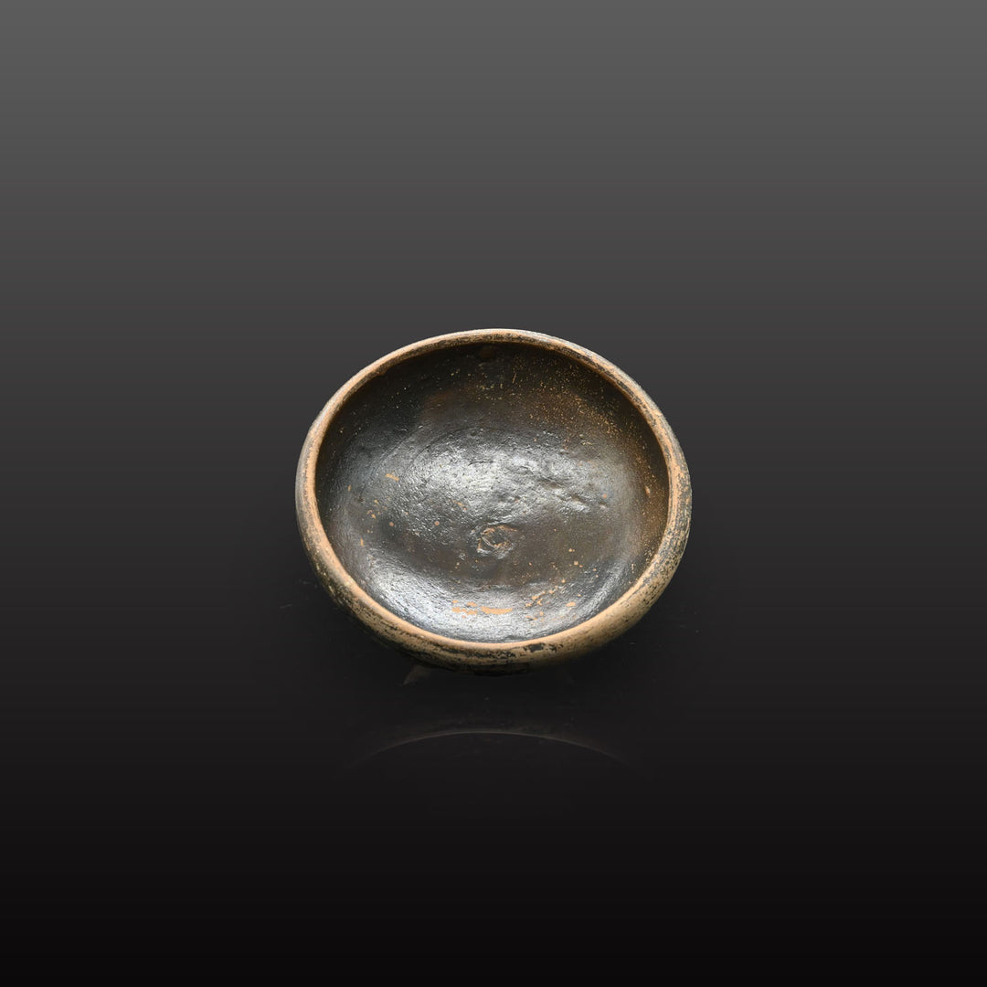 A small Greek Blackware Salt Dish, ca. 4th century BCE
