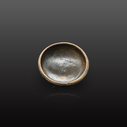 A small Greek Blackware Salt Dish, ca. 4th century BCE