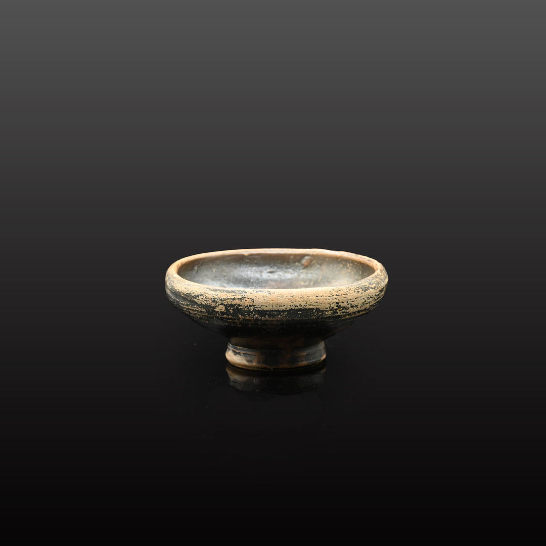 A small Greek Blackware Salt Dish, ca. 4th century BCE