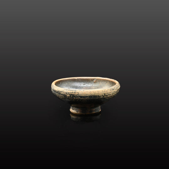 A small Greek Blackware Salt Dish, ca. 4th century BCE