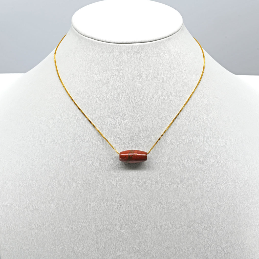 A Near Eastern Red Jasper Bead Pendant, Roman Imperial Period, ca.  1st - 2nd century CE