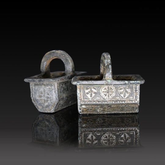 A Pair of Byzantine Copper and Silver Chariot Fittings, Late Roman Imperial Period, ca. 4th century CE