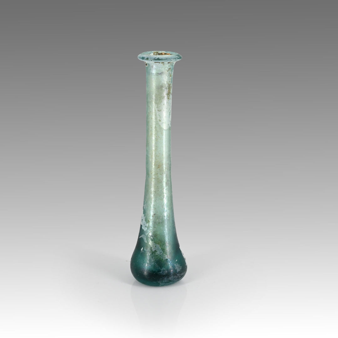 A Roman Aqua Blue Glass Tear Bottle, Roman Imperial Period, ca. 1st - 2nd century CE