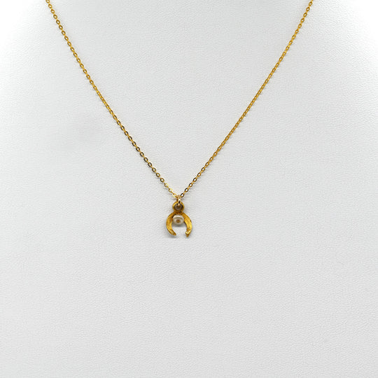 A tiny Roman Gold and Pearl Luna Pendant, Roman Imperial Period, ca. 1st - 2nd century CE