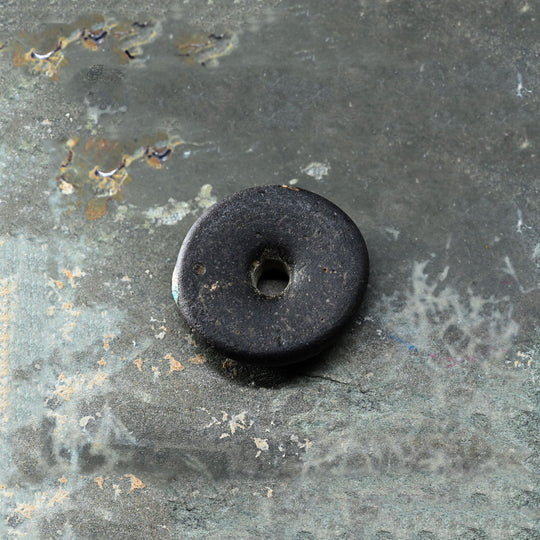 A Roman Decorated Glass Spindle Whorl,  Roman Imperial Period, ca. 2nd - 3rd century CE