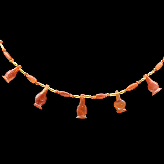 An Egyptian Carnelian Poppy Bead Necklace, 18th Dynasty, Amarna Period, ca.  1364 - 1347 BCE