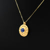 A Neo-Assyrian Gold and Glass pendant, ca. 9th to 7th century BCE