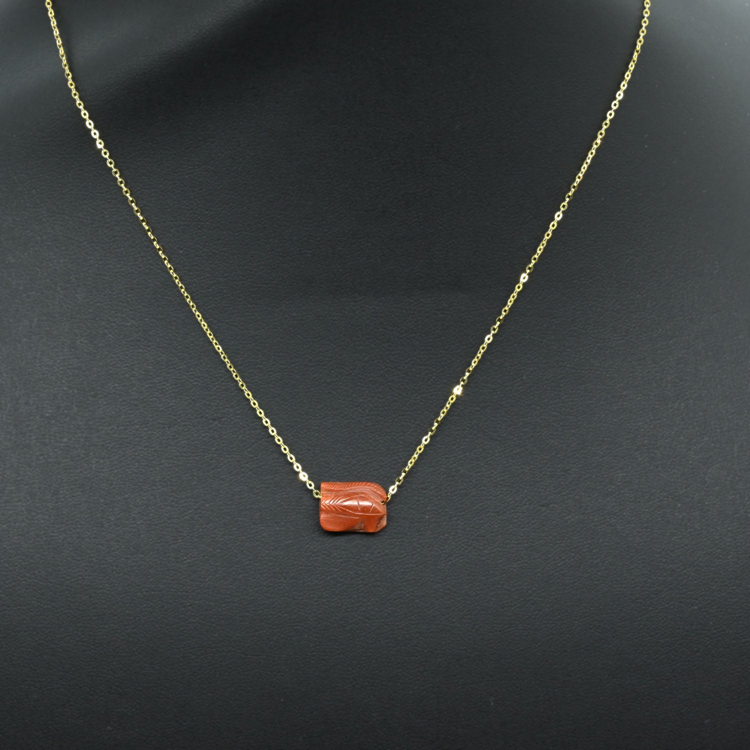 An Egyptian Carnelian Wedjat eye Pendant, New Kingdom, 18th - 19th Dynasty, ca. 1550 - 1290 BCE